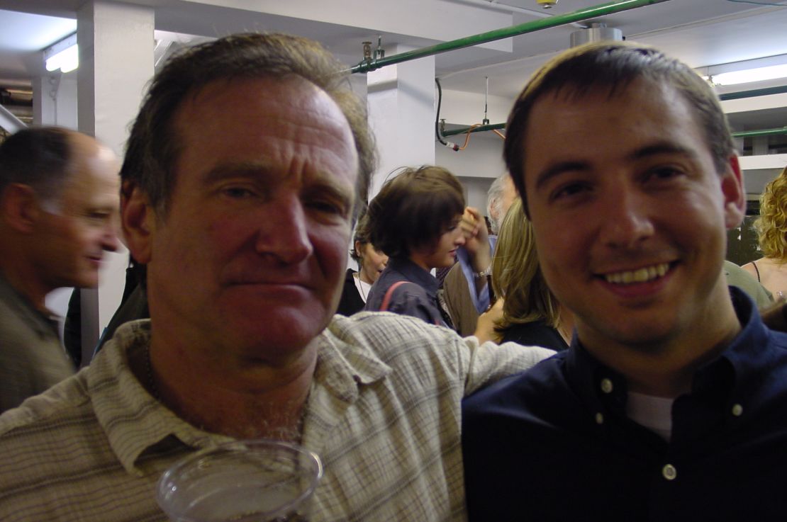Williams and David Buist, who was suffering from a rare form of lymphomia, pose together backstage at 2004 performance.
