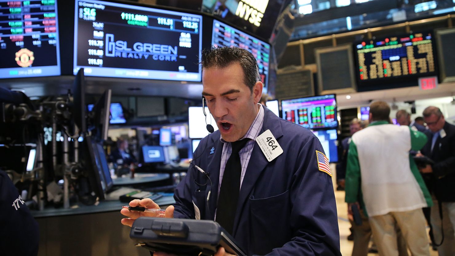 Traders work on the floor of the New York Stock Exchange in July 2014.