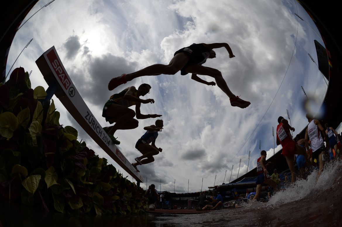 AUGUST 12 - ZURICH, SWITZERLAND: Athletes compete in the men's 3000 meter steeplechase heats at the European Athletics Championships at the Letzigrund stadium. The event will host <a href="http://www.zuerich2014.ch/en/group-1/event/facts-and-figures" target="_blank" target="_blank">around 1400 athletes from 50 countries</a> and will last for six days.