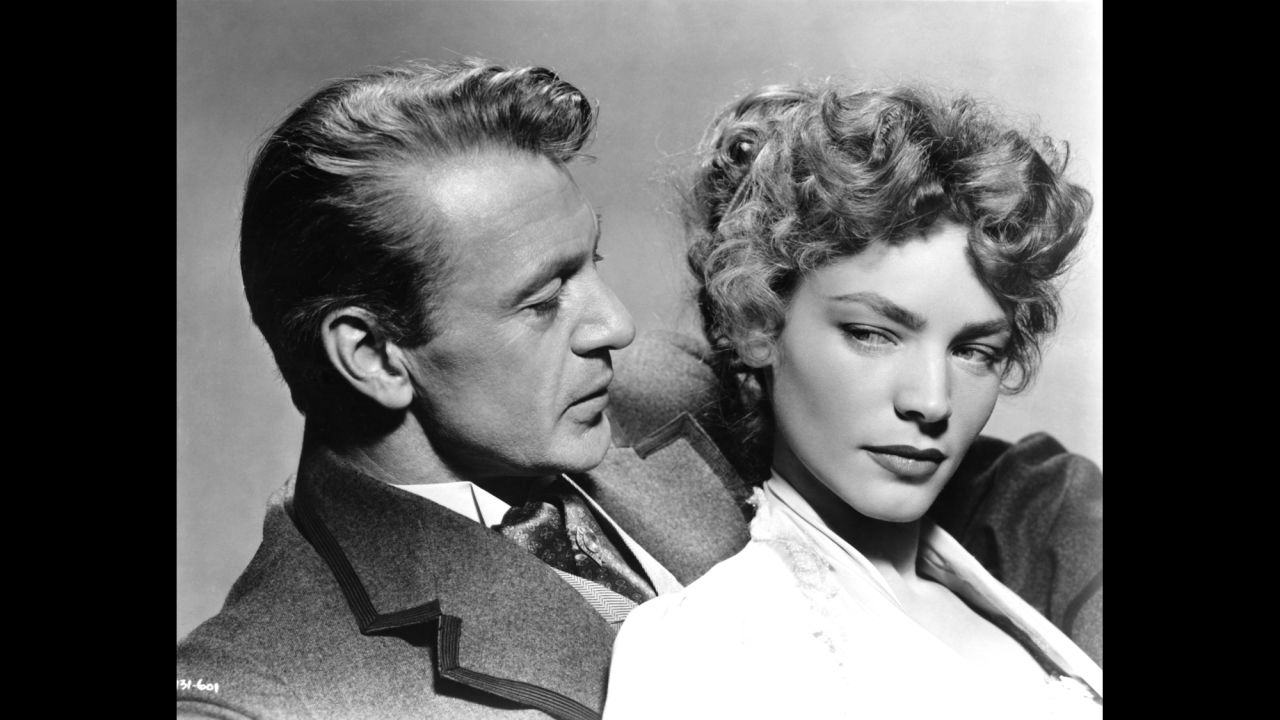 Actor Gary Cooper and Bacall pose for a studio portrait to promote their movie "Bright Leaf" in 1950 in Los Angeles. 