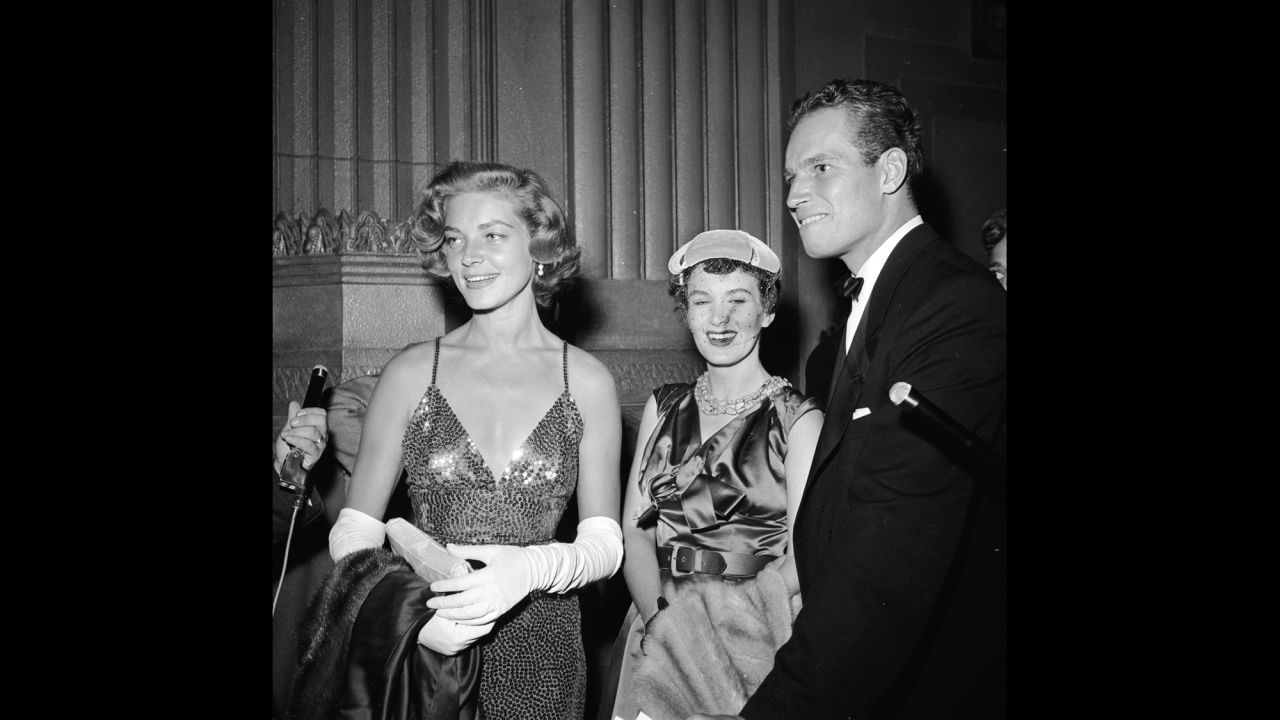 In 1954, Bacall and actor Charlton Heston attend the film premiere of "A Star Is Born."