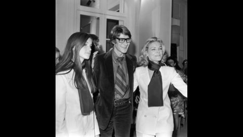 French designer Yves Saint-Laurent with Bacall and her daughter Leslie at a showing of his latest collection in Paris in 1968. 