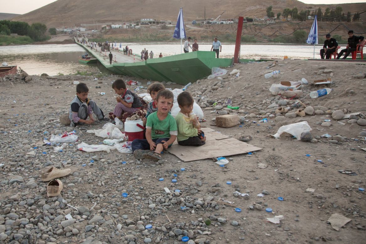 Children rest after arriving back into Kurdish-controlled Iraq.
