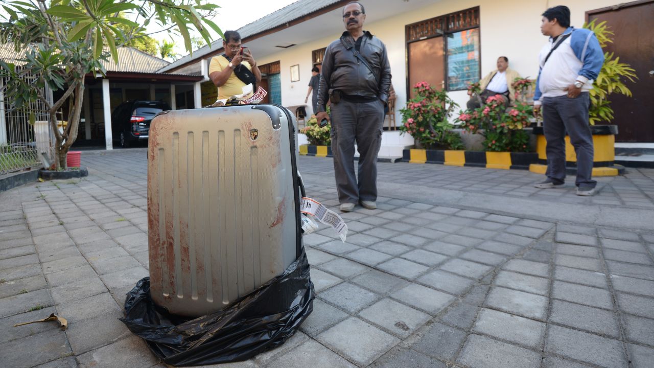 The body of Sheila von Weise Mack, 62, was stuffed in this hard-sided gray suitcase, displayed here at a police station.