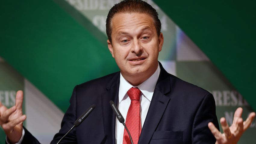 Former Pernambuco State governor Eduardo Campos, candidate of the Brazilian Socialist Party (PSB) for October's presidential election, speaks with businessmen at the National Agriculture Confederation headquarters in Brasilia, on August 6, 2014.