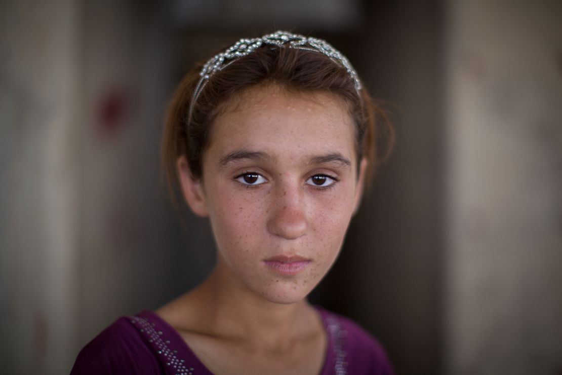 Aziza Hamid, 15, was rescued from Mount Sinjar and now lives in a derelict building that houses more than a thousand other refugees.
