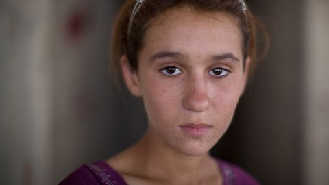 Aziza Hamid, 15, was rescued from Mount Sinjar and now lives in a derelict building that houses more than a thousand other refugees.