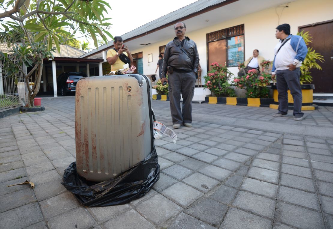 The body of Sheila von Weise Mack, 62, was stuffed in this hard-sided gray suitcase, displayed here at a police station.