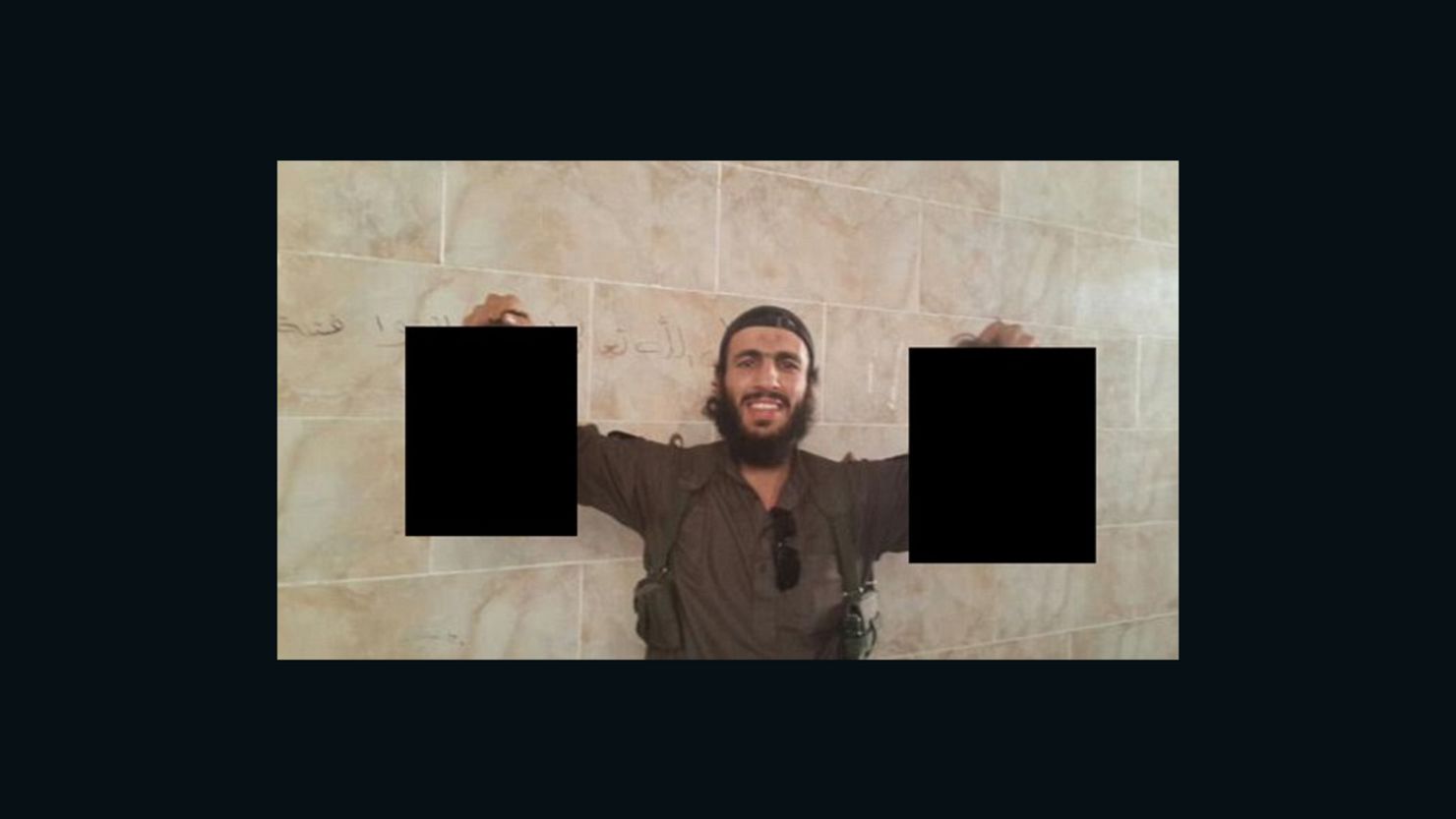 An image believed to be of Mohamed Elomar holding severed heads posted to Twitter.