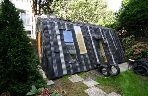 Dutch artist collective Rejunc turn wheels into walls for this garden office project. 