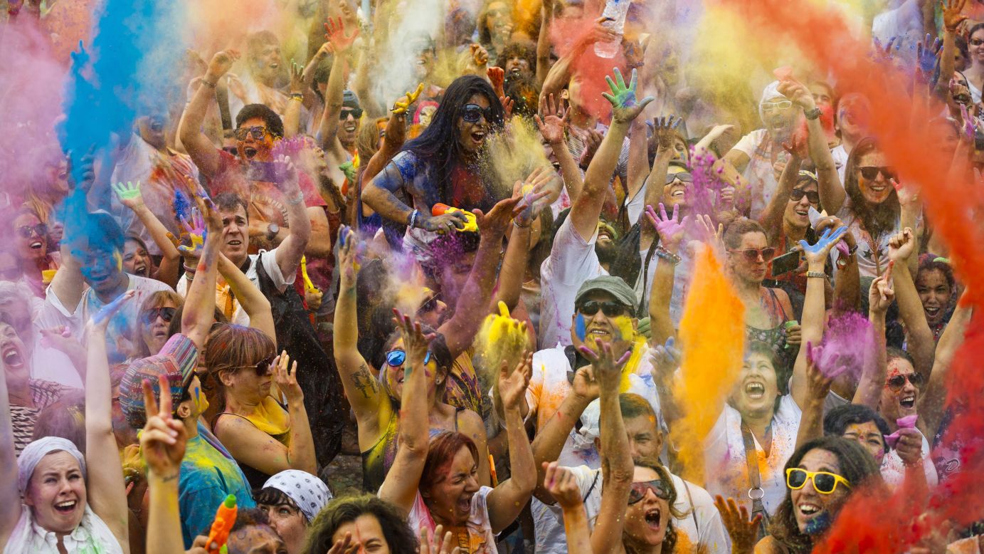 Revelers in Madrid throw colored powder in the air during the Holi Festival of Colors on Saturday, August 9. The festival was fashioned after the <a href="http://www.cnn.com/2014/03/17/asia/gallery/holi-2014/index.html">annual Hindu festival</a> that celebrates the arrival of spring.
