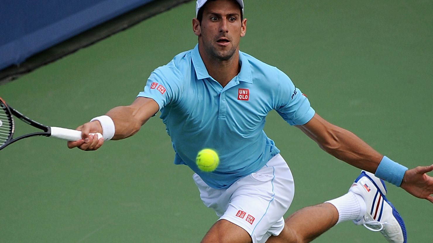 Novak Djokovic at full stretch during his third round defeat to Tommy Robredo in Cincinnati.