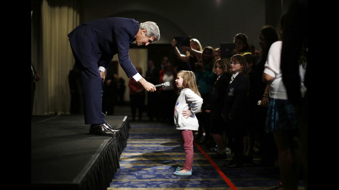 U.S. Secretary of State John Kerry speaks with Dara Edwards, the 5-year-old daughter of an American staff member at the U.S. Consulate in Sydney, as he met with embassy and consular staff there on Tuesday, August 12.