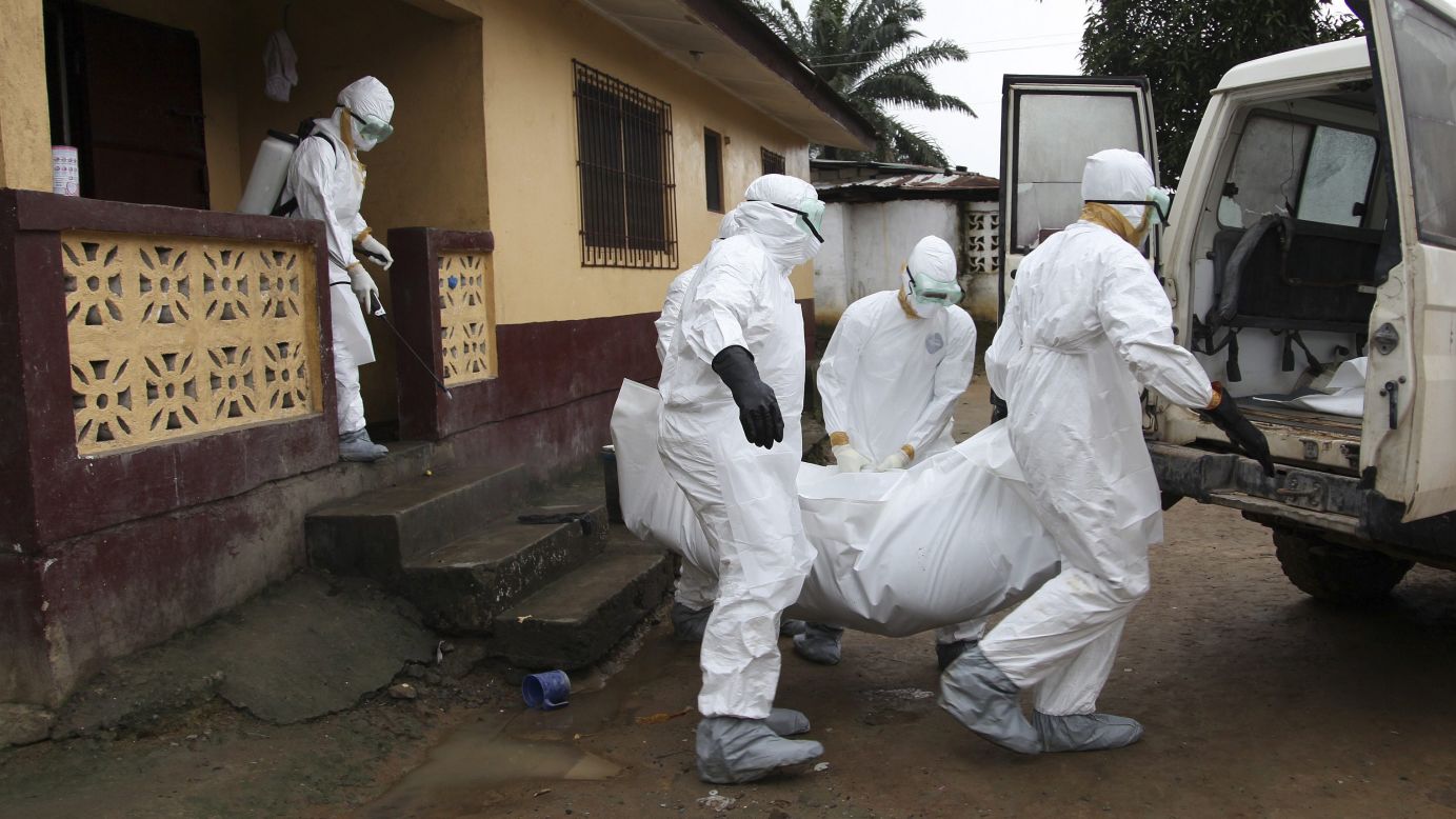 Nurses carry the body of an Ebola victim from a house outside Monrovia, Liberia, on Friday, August 8. Health officials say the current <a href="http://www.cnn.com/2014/04/04/world/gallery/ebola-in-west-africa/index.html">Ebola outbreak in West Africa</a> is the deadliest ever. The virus has killed more than 1,000 people this year in Guinea, Liberia, Nigeria and Sierra Leone.