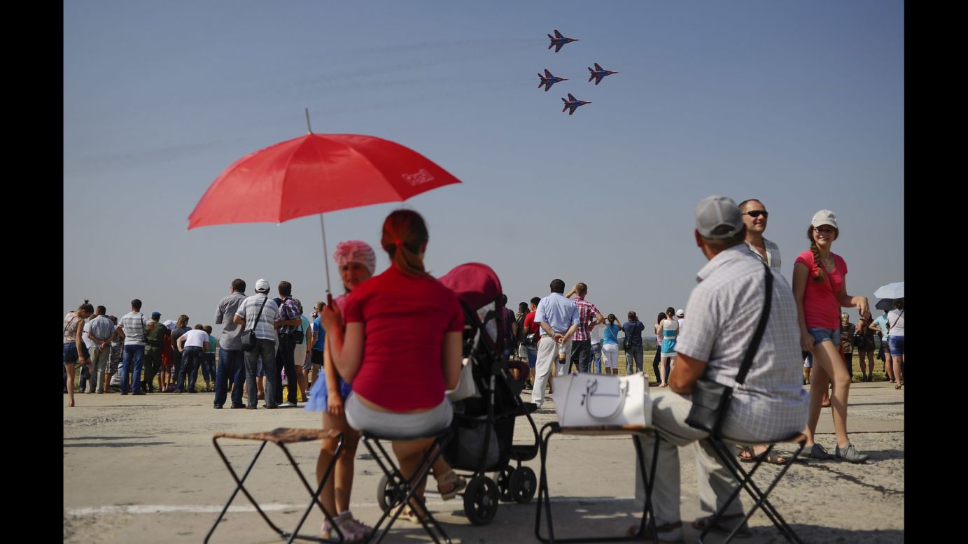 People attend an air show in Lipetsk, Russia, on Tuesday, August 12. It was Russian Air Force Day.