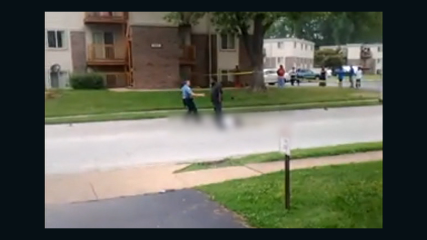 Blurred shot of Michael Brown's body in street