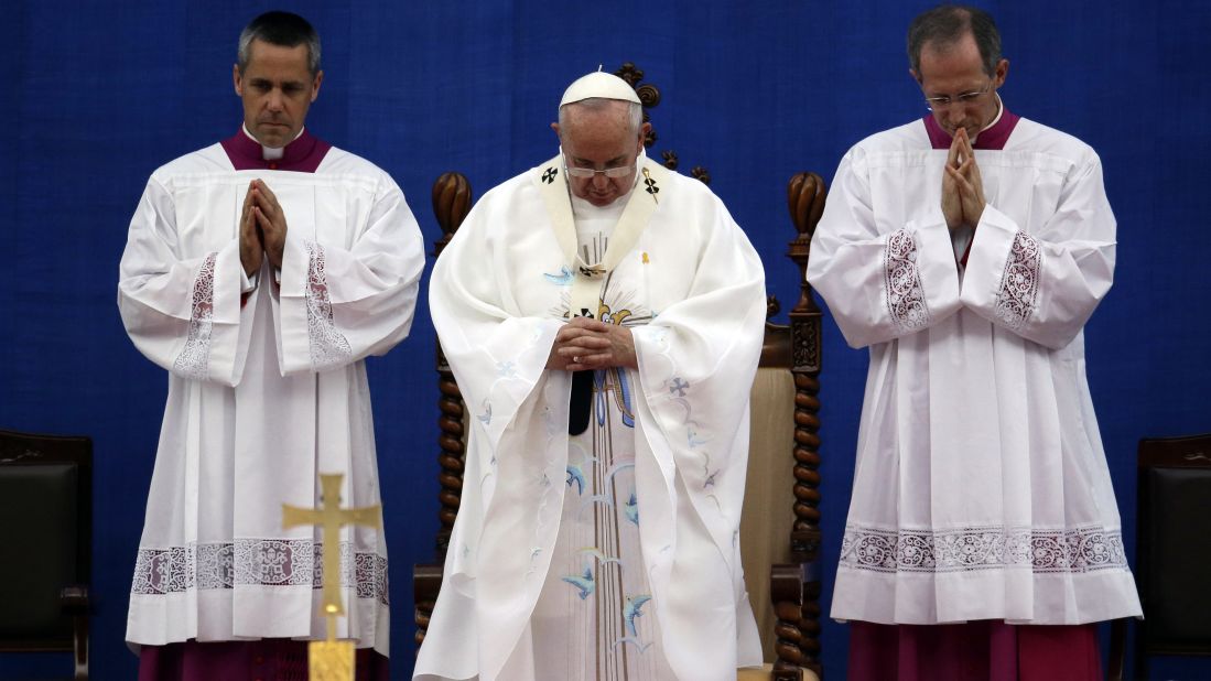 Pope Francis prays during the Mass of the Assumption of Mary on August 15.