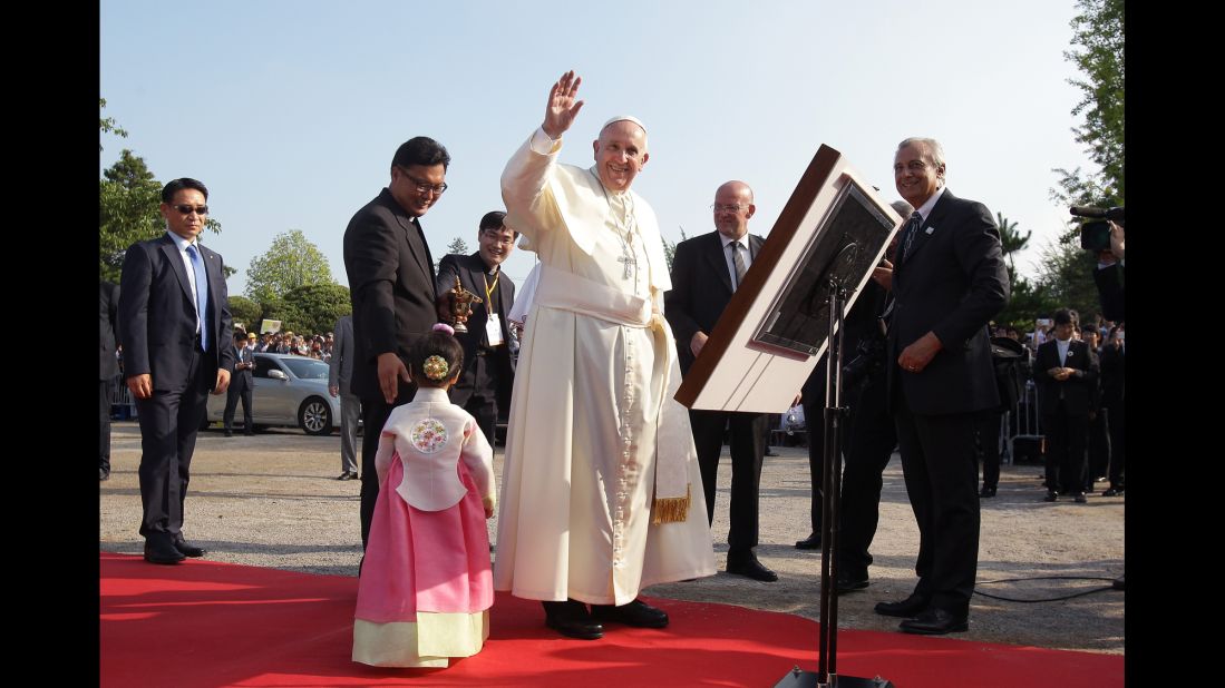 Pope Francis waves to a crowd during his visit to the birthplace of Saint Kim Taegon Andrea, who was the first Korean-born Catholic priest and is the patron saint of Korea, at the Solmoe Shrine for Korea's Catholic martyrs on August 15.