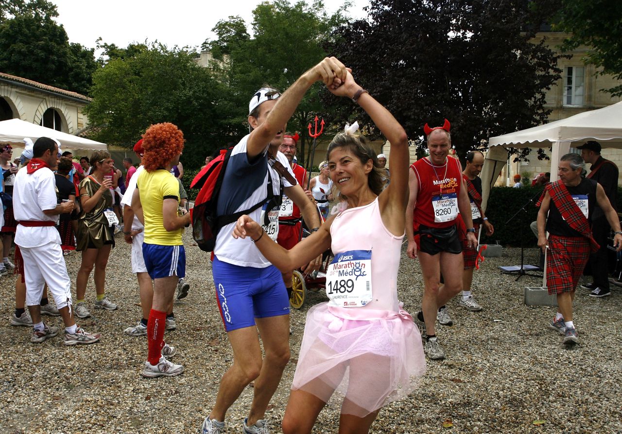Impromptu dance breaks are an essential part of the race for many taking part in the Medoc Marathon. 