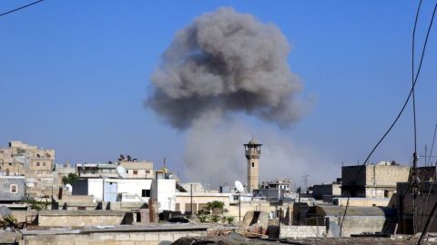 Smoke trails over Aleppo following barrel bombs that were allegedly dropped by the Syrian regime on an opposition-controlled area on Monday, August 11.
