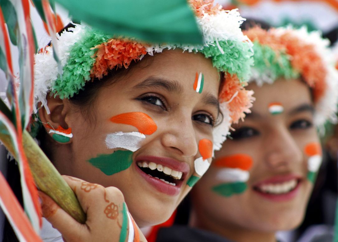 AUGUST 15 - AJMER, INDIA: Schoolgirls dressed in the colors of the Indian flag participate in rehearsals for Independence Day celebrations. The 68th annual event marks the country's freedom from British rule on this day in 1947.