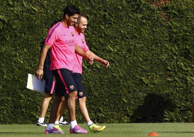 Luis Suarez has completed his first training session with his Barcelona teammates. The Uruguayan lost his appeal to have his four-month "biting ban" reduced by the <a href="index.php?page=&url=http%3A%2F%2Fcnn.com%2F2014%2F08%2F14%2Fsport%2Ffootball%2Fluis-suarez-biting-ban-cas-barcelona%2Findex.html">Court of Arbitration for Sport</a> on Thursday but the restriction on him training with his new teammates was lifted. The former Liverpool player, seen here with Andreas Iniesta, cannot play competitive football for Barcelona until the end of October.    
