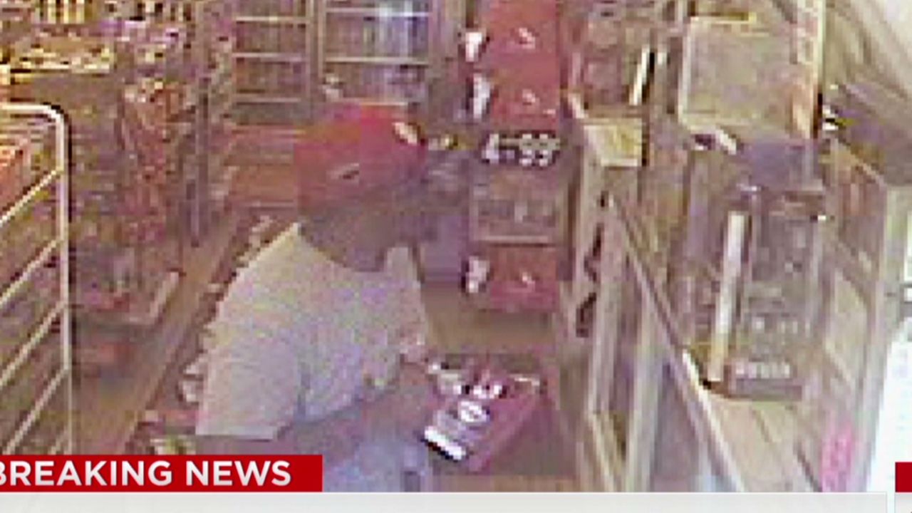 A convenience store surveillance video purports to show Michael Brown before he was fatally shot by police.