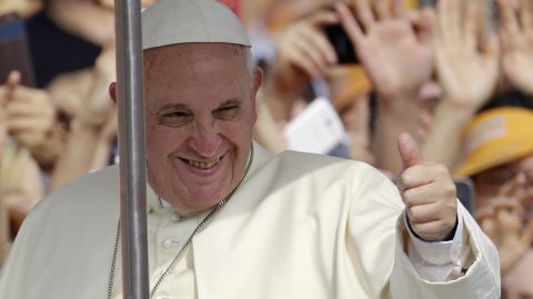 Pope Francis gives a thumbs up sign as he is greeted by the faithful upon arrival for the beatification mass of Paul Yun Ji-Chung and his 123 martyr companions in Seoul, South Korea, Saturday, Aug. 16, 2014. Paul Yun Ji-Chung, born in 1759, was among the earliest Catholics on the Korean Peninsula. (AP Photo/Lee Jin-man, Pool)