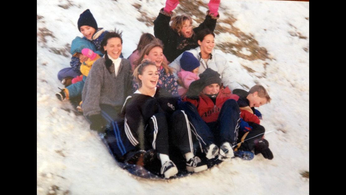  Cynthia Scudo sleds with all of her eight children.