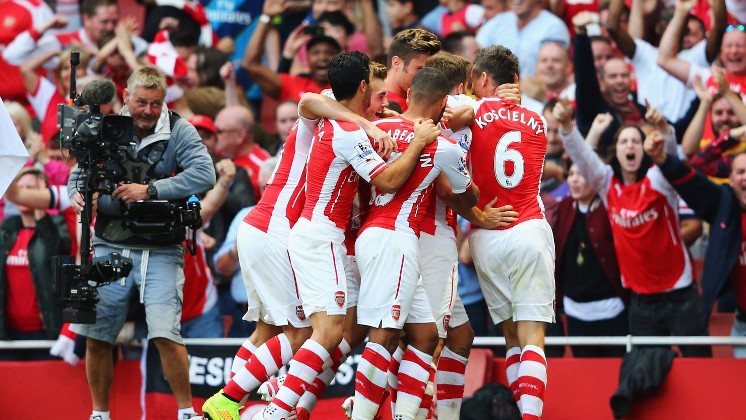 Arsenal players celebrate after Aaron Ramsey scores a late winner against Crystal Palace.