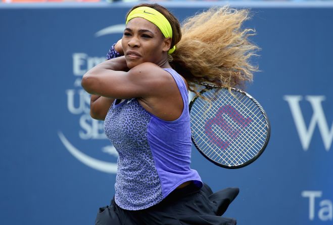 With her hair -- <a href="index.php?page=&url=https%3A%2F%2Fwww.cnn.com%2F2012%2F08%2F15%2Fsport%2Ftennis%2Fserena-venus-roddick-williams-tennis%2Findex.html" target="_blank">which she once described as "super crazy"</a> -- tied back, Serena blasts a shot in a match against Ana Ivanovic in Cincinnati.