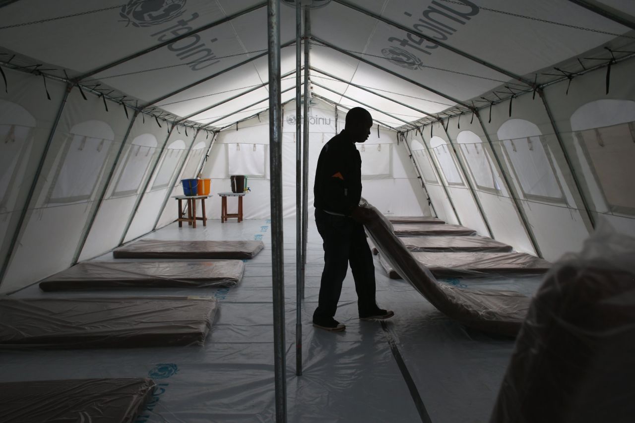Workers prepare the new Ebola treatment center on August 17, 2014.