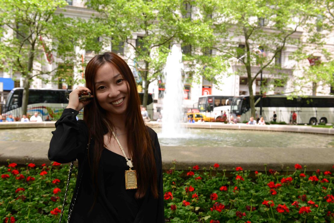 Graduate student Zhang Yuzhu makes extra money by buying designers bags for customers found through social media