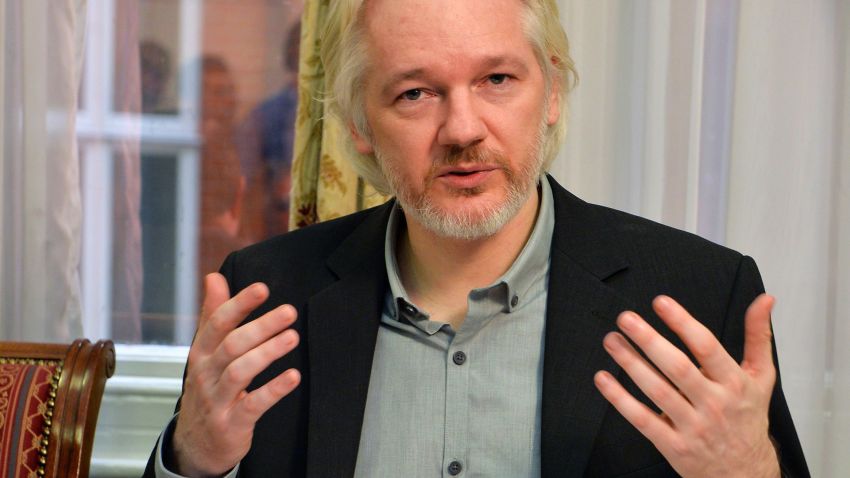 WikiLeaks founder Julian Assange speaks during a press conference inside the Ecuadorian Embassy in London, where he confirmed he "will be leaving the embassy soon", Monday Aug. 18, 2014. The Australian Assange fled to the Ecuadorian Embassy in 2012 to escape extradition to Sweden, where he is wanted over allegations of sex crimes.