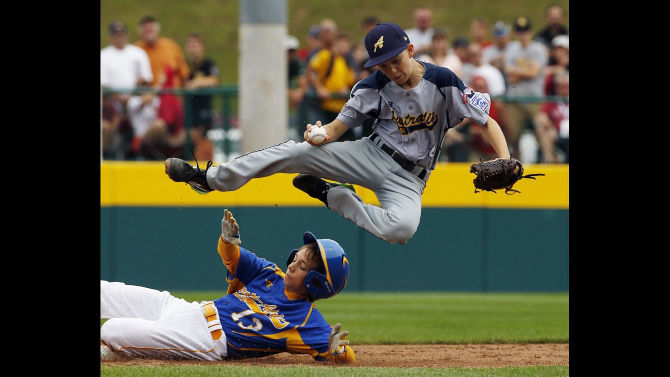 Australia's Calvin Eissens, top, leaps in the air to avoid a slide from Marek Krejcirik of the Czech Republic during a Little League World Series game Saturday, August 16, in South Williamsport, Pennsylvania. Australia won the game 10-1 to advance in the tournament's international bracket.
