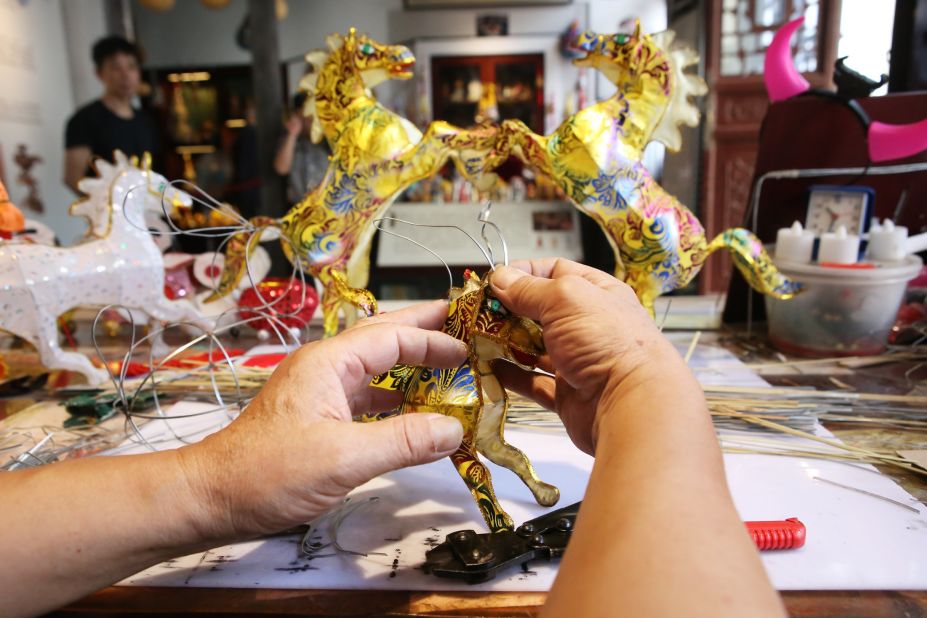 "From sourcing the materials to gluing the lanterns, around 30 procedures are involved in making each lantern," says Cao.
