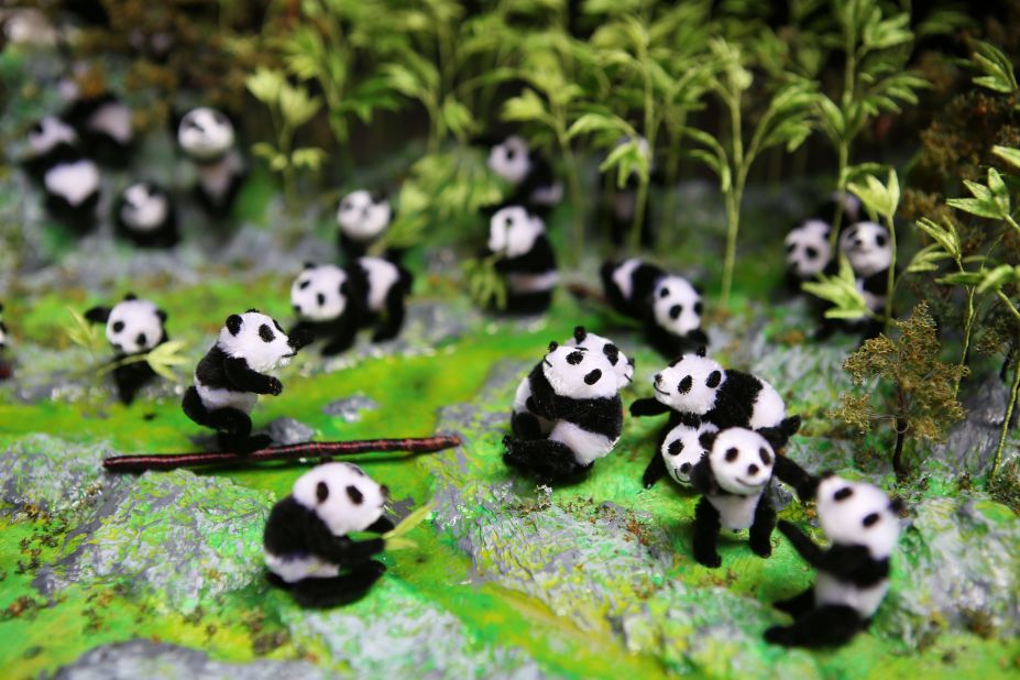 This panda scene was made by Nanjing velvet-flower artist Zhao Shu-xian. The Chinese word for velvet flowers refers to all figures made from thin copper sticks covered with silk velvet. Nanjing is the birthplace of many of the country's traditional arts. 