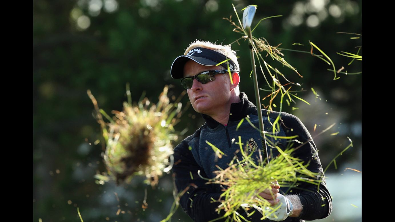 Grass flies in the air as golfer Simon Dyson hits a shot Friday, August 15, during the European Tour event in Aalborg, Denmark.