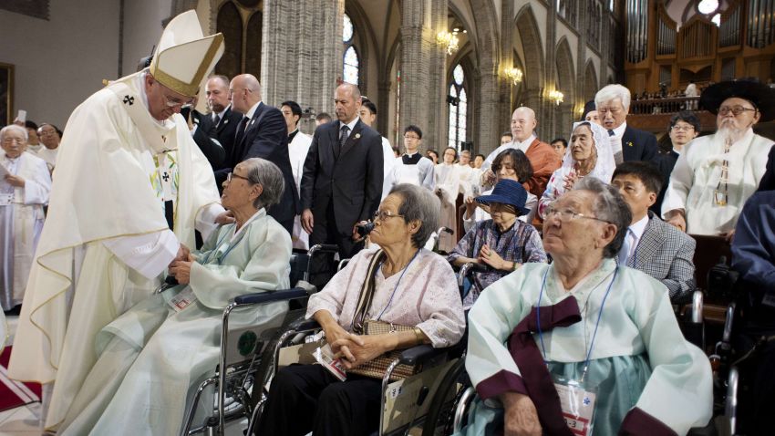 This handout picture released by the Osservatore Romano shows Pope Francis (L) meeting with former "comfort women", Koreans forced to work in Japanese wartime military brothels, prior to celebrate a mass for peace and reconciliation at the cathedral on August 18, 2014 in Seoul. Pope Francis wrapped up the first papal visit to Asia in 15 years on August 18, urging the divided Koreas to reject suspicion and confrontation and unite as "one family, one people". 

AFP PHOTO / OSSERVATORE ROMANO -RESTRICTED TO EDITORIAL USE - MANDATORY CREDIT "AFP PHOTO / OSSERVATORE ROMANO" - NO MARKETING NO ADVERTISING CAMPAIGNS - DISTRIBUTED AS A SERVICE TO CLIENTS
