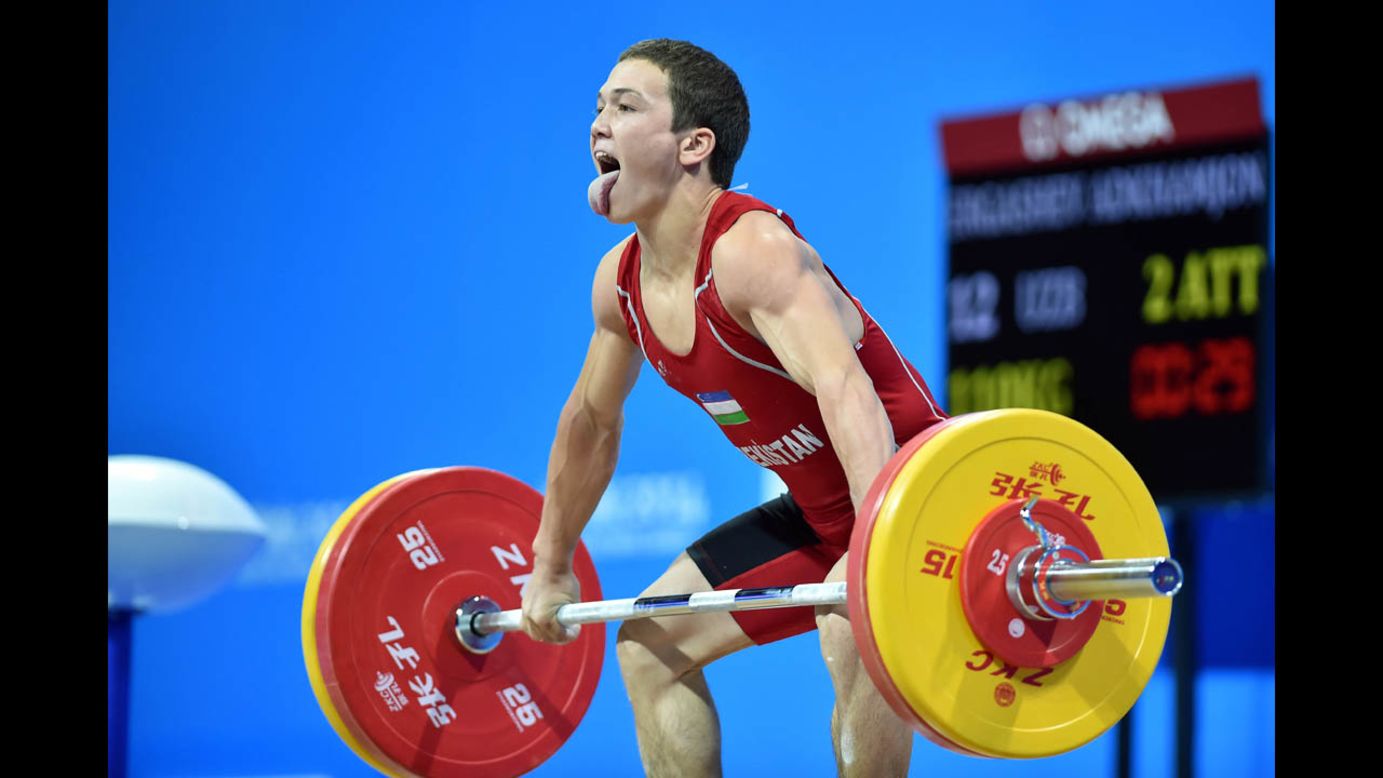 Uzbek weightlifter Adkhamjon Ergashev competes Sunday, August 17, at the Youth Olympic Games in Nanjing, China. He won bronze in his weight category.