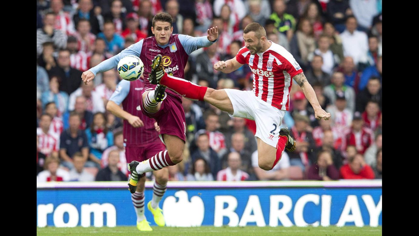 Stoke City's Phil Bardsley, right, challenges Aston Villa's Ashley Westwood during their Premier League match Saturday, August 16, in Stoke-on-Trent, England. Aston Villa won 1-0. <a href="http://www.cnn.com/2014/08/12/worldsport/gallery/what-a-shot-0812/index.html">See 30 amazing sports photos from last week</a>