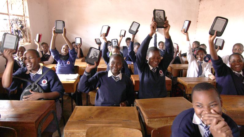 Academy students show off their Kindle e-readers. "The Kindle is very important," said Abdul Kassim, the school's founder and executive director. "It means their life."