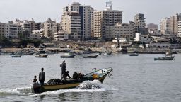Fishermen ride a small boat into the harbour on August 18, 2014 in Gaza City. Egyptian-brokered indirect negotiations between Israel and the Palestinians are taking place in Egypt during a five-day lull in the fighting that is due to expire at midnight (2100 GMT). Hamas, the defacto rulers of the impoverished enclave, want a firm Israeli commitment to end the blockade of Gaza and demand an airport in the coastal strip. AFP PHOTO/ROBERTO SCHMIDTROBERTO SCHMIDT/AFP/Getty Images