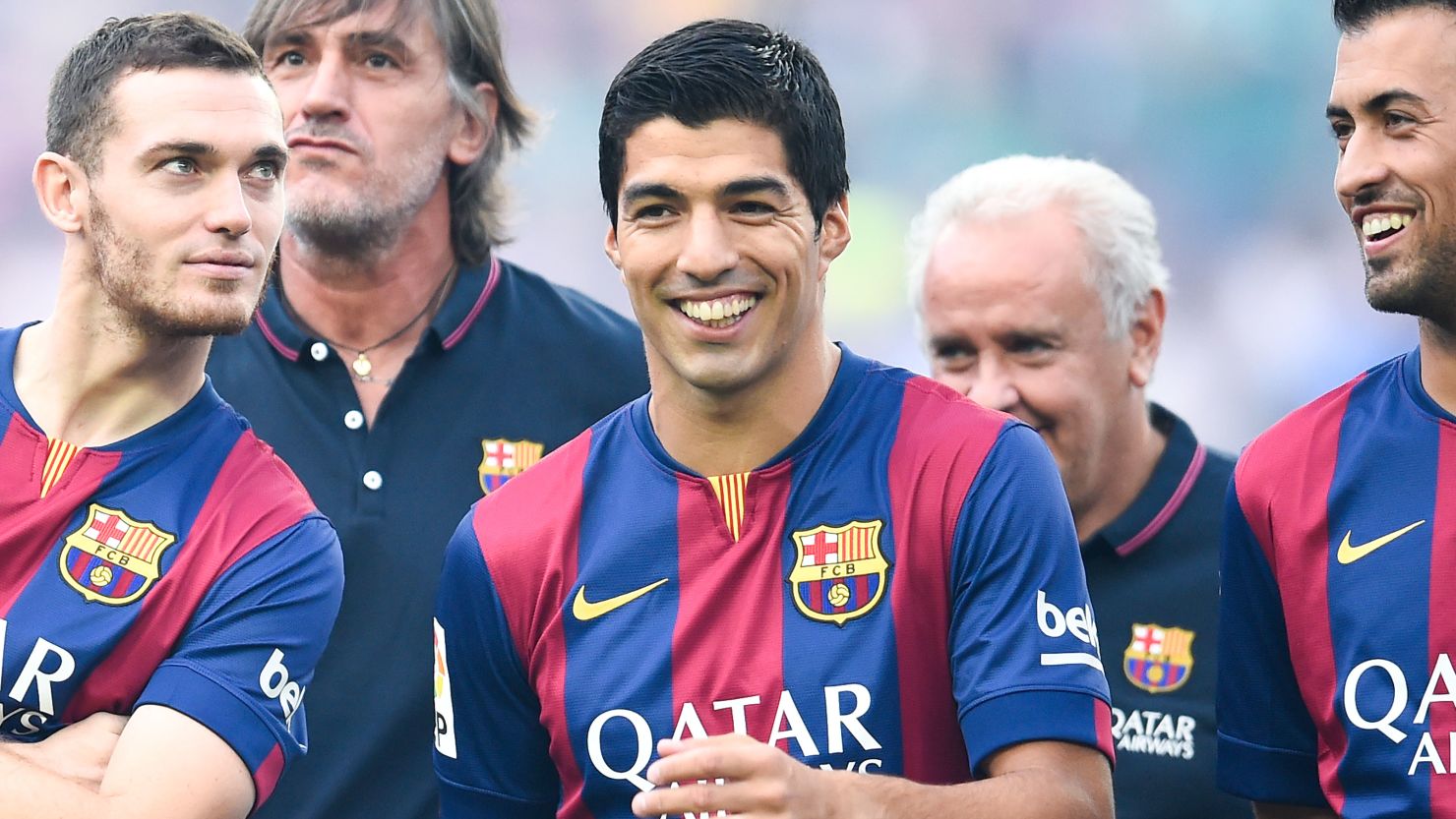 Luis Suarez, center, not Thomas Vermaelen, left, or Sergio Busquets, right, stole the spotlight Monday at the Camp Nou. 