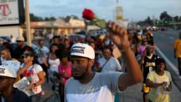 FERGUSON, MO - AUGUST 18: Demonstrators protesting the shooting death of Michael Brown make their voices heard on August 18, 2014 in Ferguson, Missouri. Protesters have been vocal asking for justice in the shooting death of Michael Brown by a Ferguson police officer on August 9th. (Photo by Joe Raedle/Getty Images)