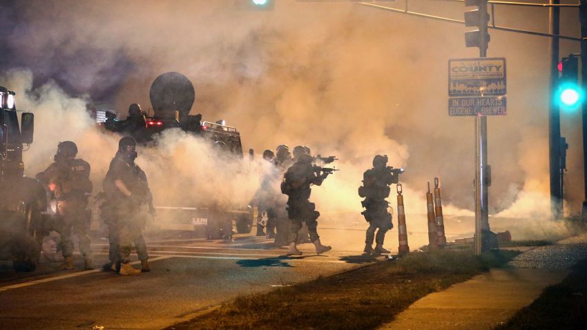 Police attempt to control protesters in the streets of Ferguson, Missouri, on Monday, August 18.