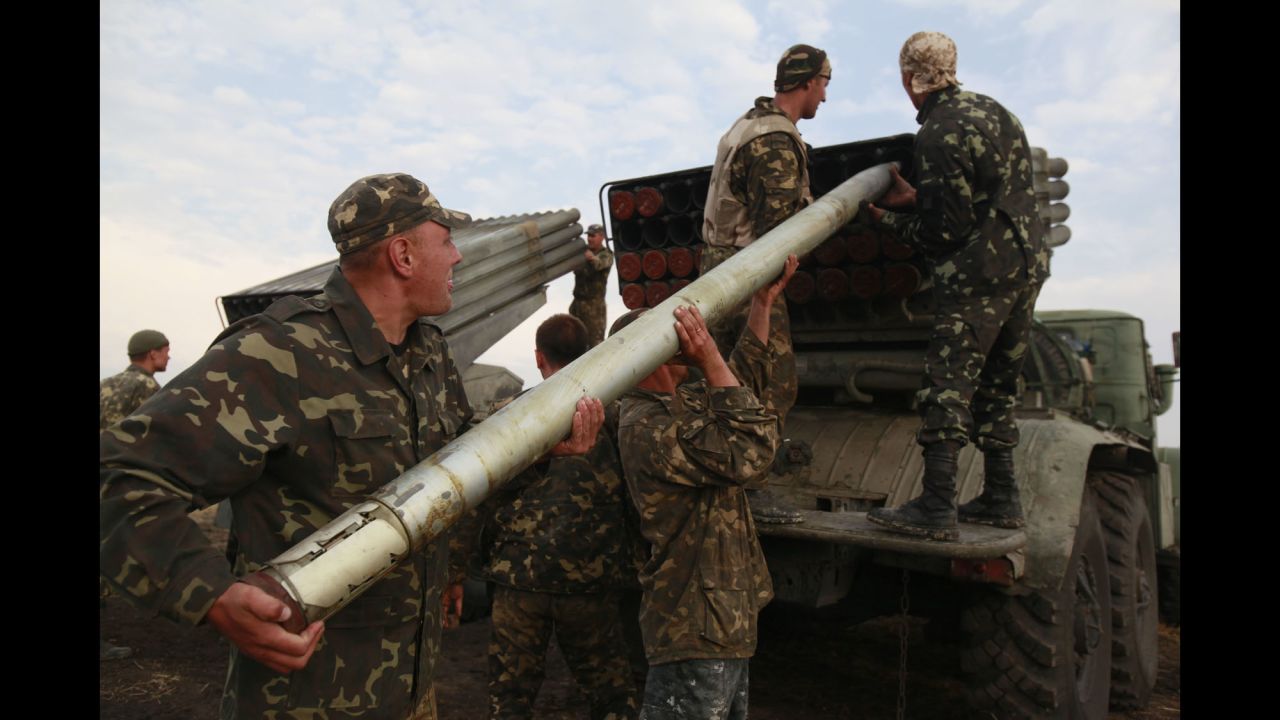 Ukrainian soldiers load a missile during fighting with pro-Russian rebels Monday, August 18, near Luhansk.