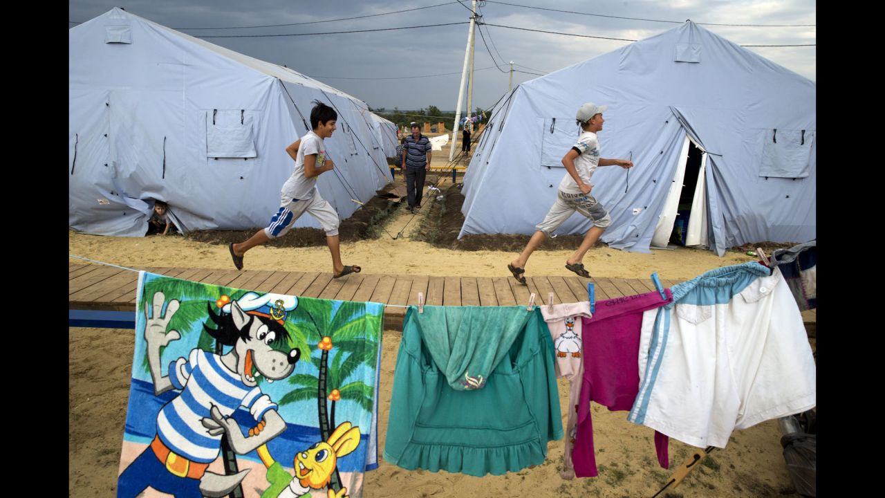 Boys play at a refugee camp, set up by the Russian Emergencies Ministry, near the Russian-Ukrainian border on August 18.