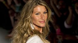 Brazilian supermodel Gisele Bundchen presents a creation by Colcci during the 2015 Summer collections of the Sao Paulo Fashion Week in Sao Paulo, Brazil, on April 2, 2014. AFP PHOTO / Nelson ALMEIDA        (Photo credit should read NELSON ALMEIDA/AFP/Getty Images)