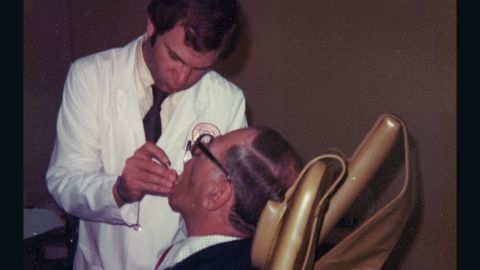 Sandy Halperin was a teacher and practicing prosthodontist at Harvard University in 1979. In this photo he is working on his father, Leon's, teeth.